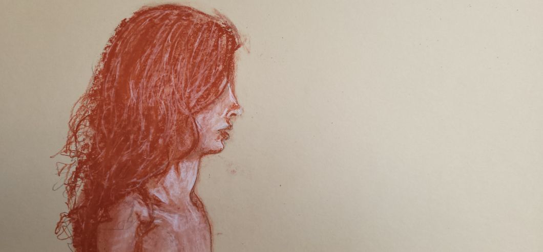 A woman’s head in profile, facing to the right
